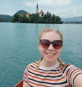 Amy holding a camera in Slovenia